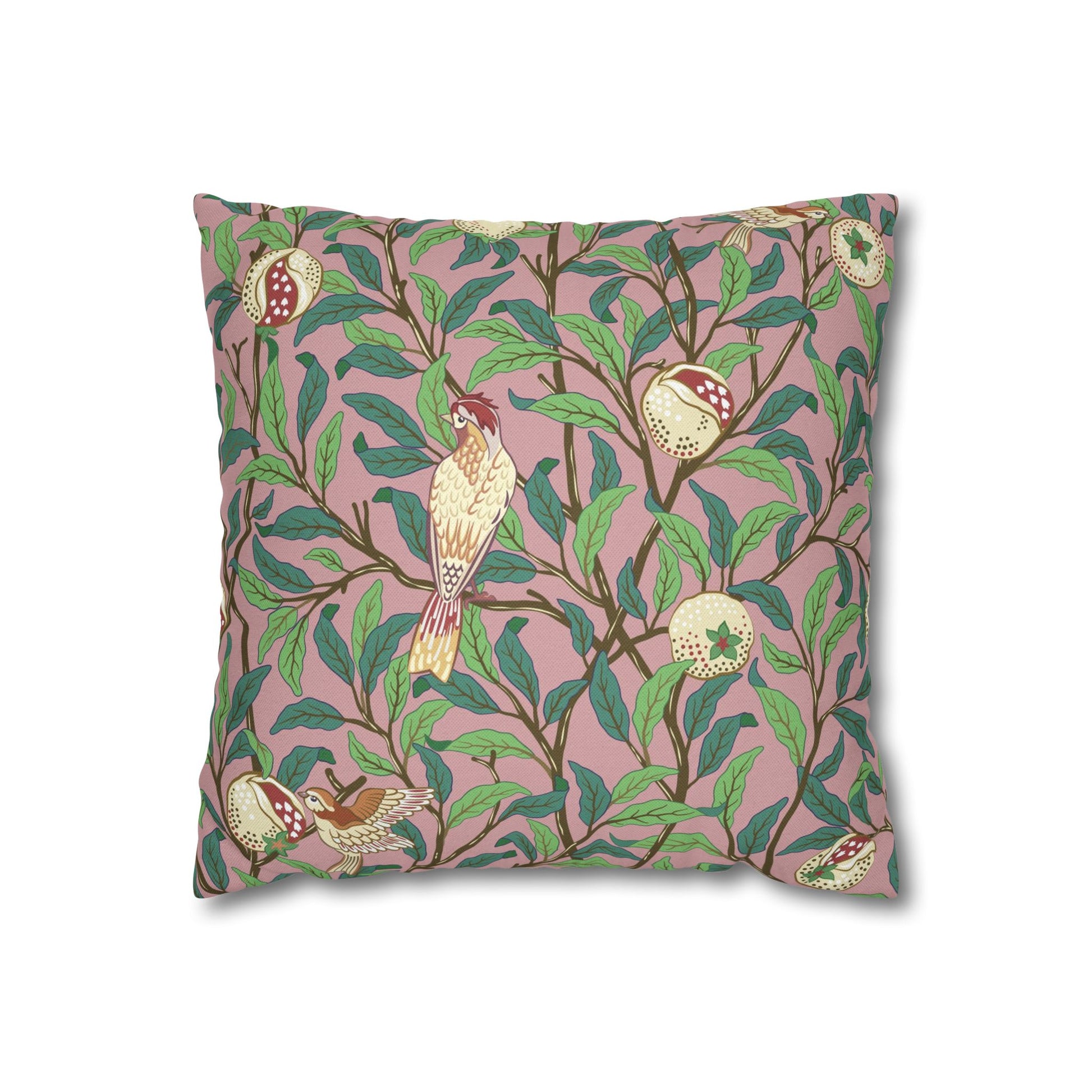 Decorative pillow with bird and floral pattern on a pink background