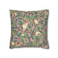 Decorative pillow with bird and leaf pattern on a pink background