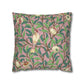 Decorative pillow with bird and leaf pattern on a pink background