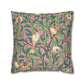 Decorative pillow with bird and pomegranate design on a pink background