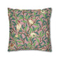 Decorative pillow with bird and leaf pattern on a pink background