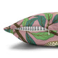 Decorative pillow with leaf pattern on a pink background