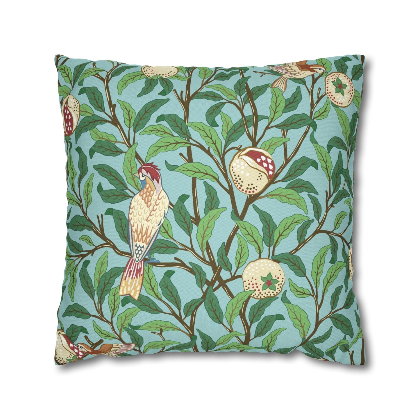 Decorative pillow with bird and branch pattern on a blue background