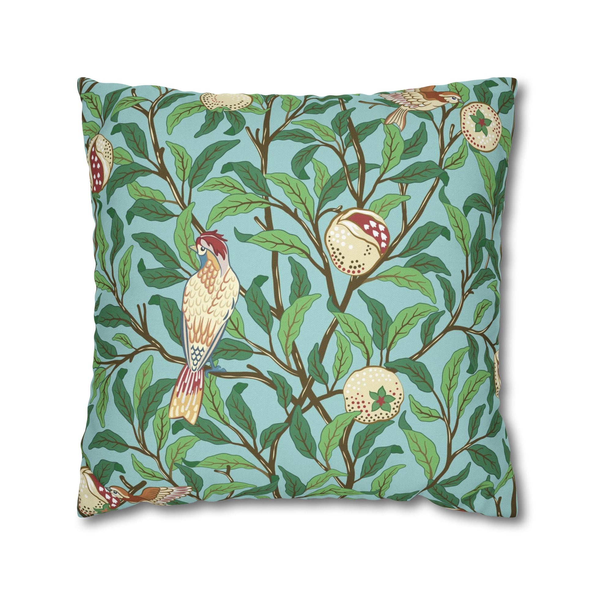Decorative pillow with bird and branch pattern on a blue background