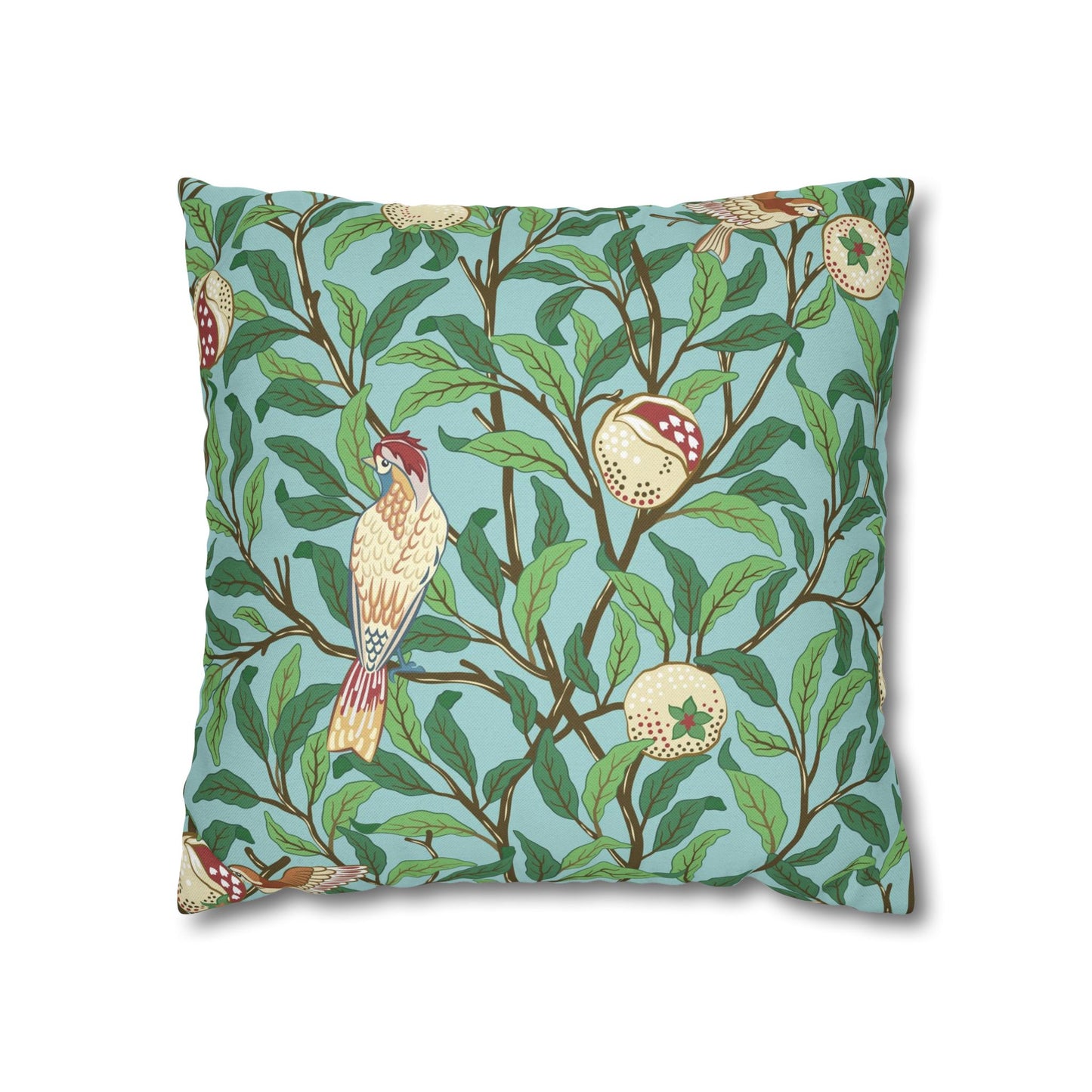 Decorative pillow with bird and branch pattern on a blue background