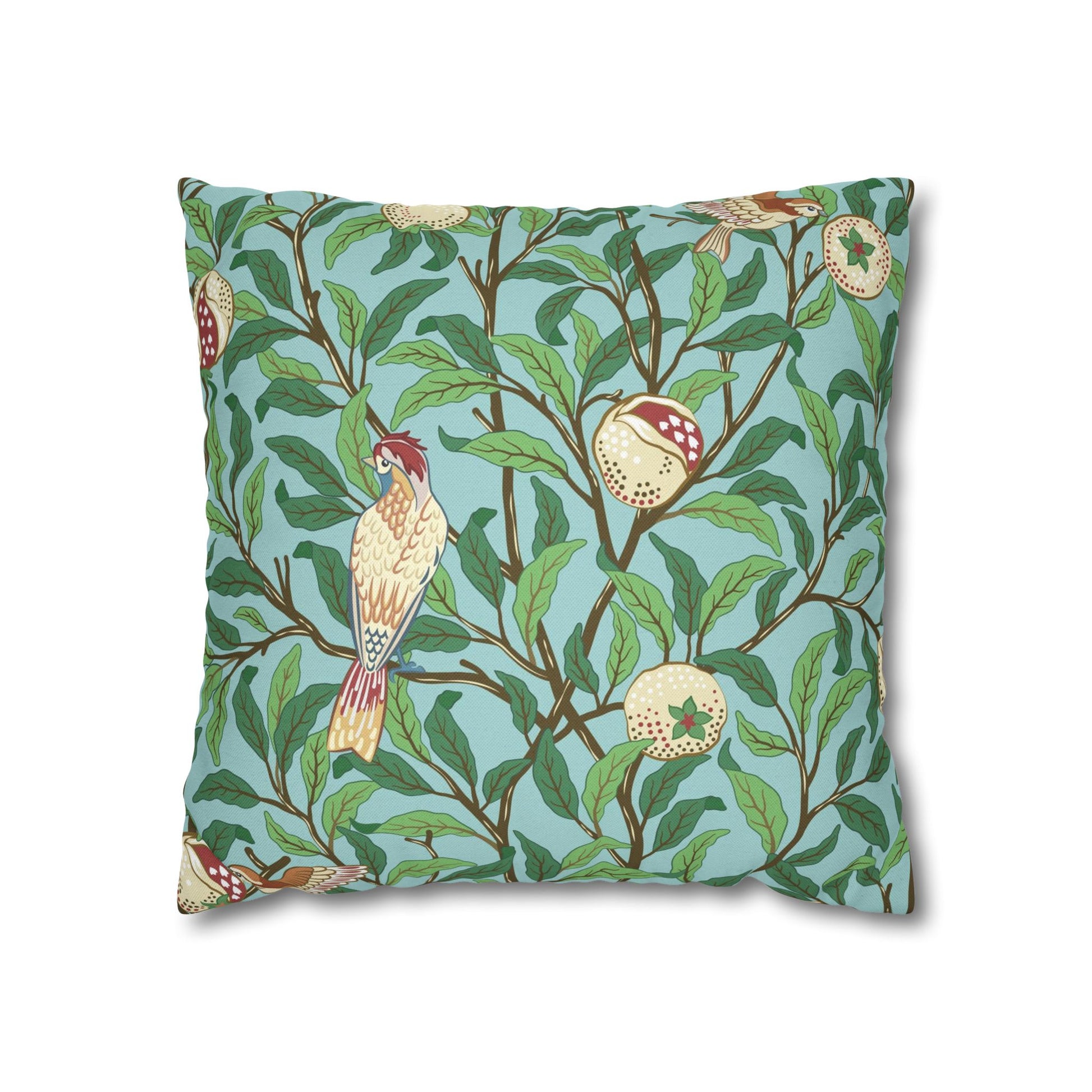 Decorative pillow with bird and branch pattern on a blue background
