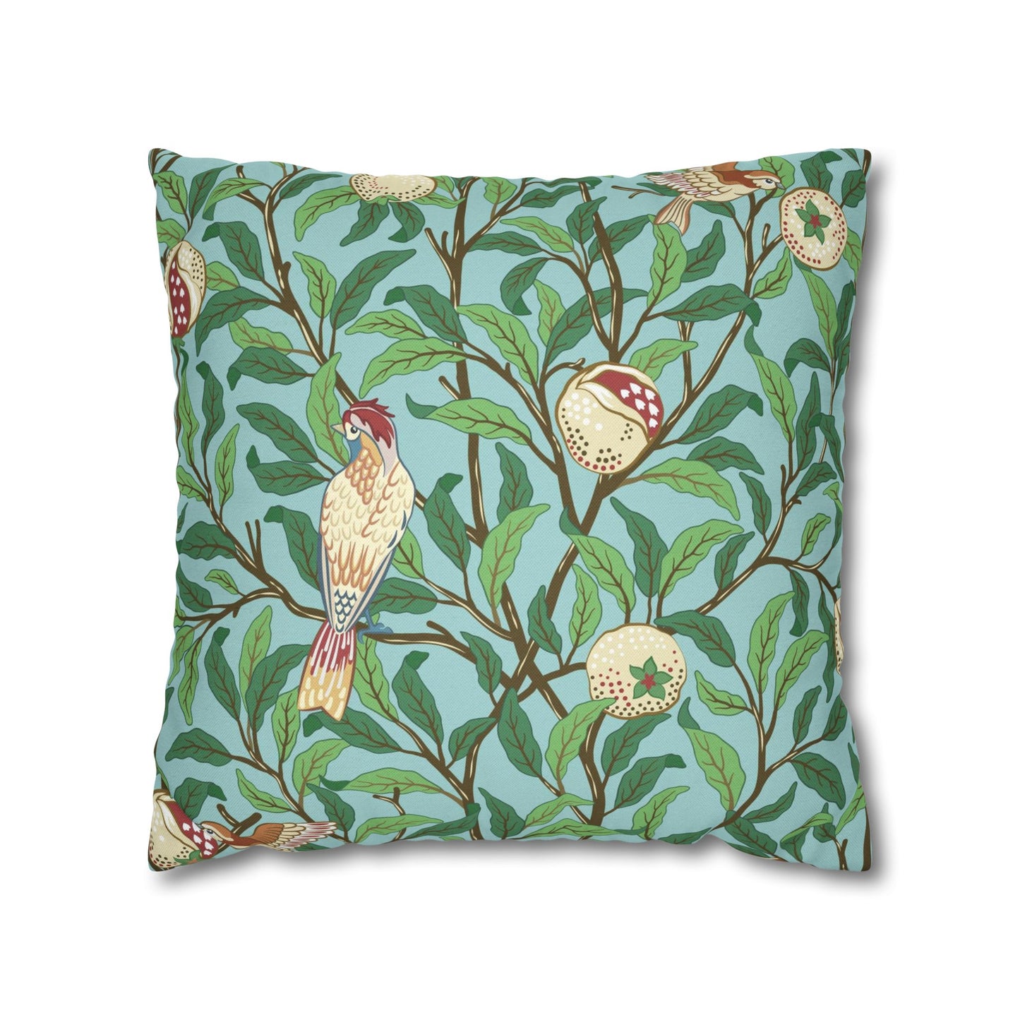 Decorative pillow with bird and leaf pattern on a blue background