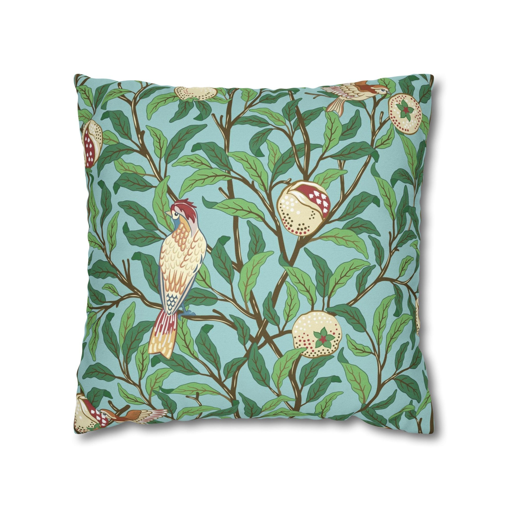 Decorative pillow with bird and leaf pattern on a blue background