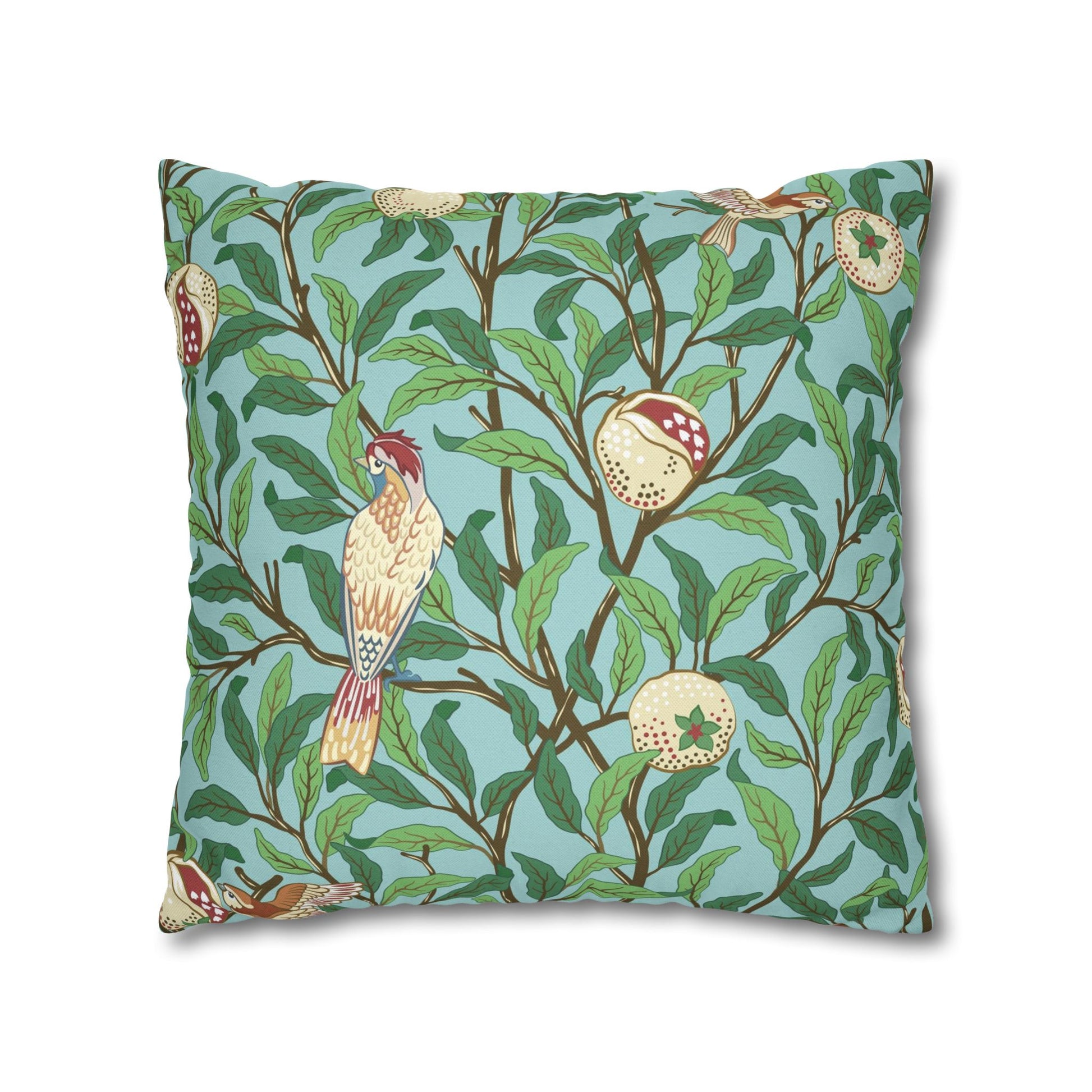 Decorative pillow with bird and leaf pattern on a blue background
