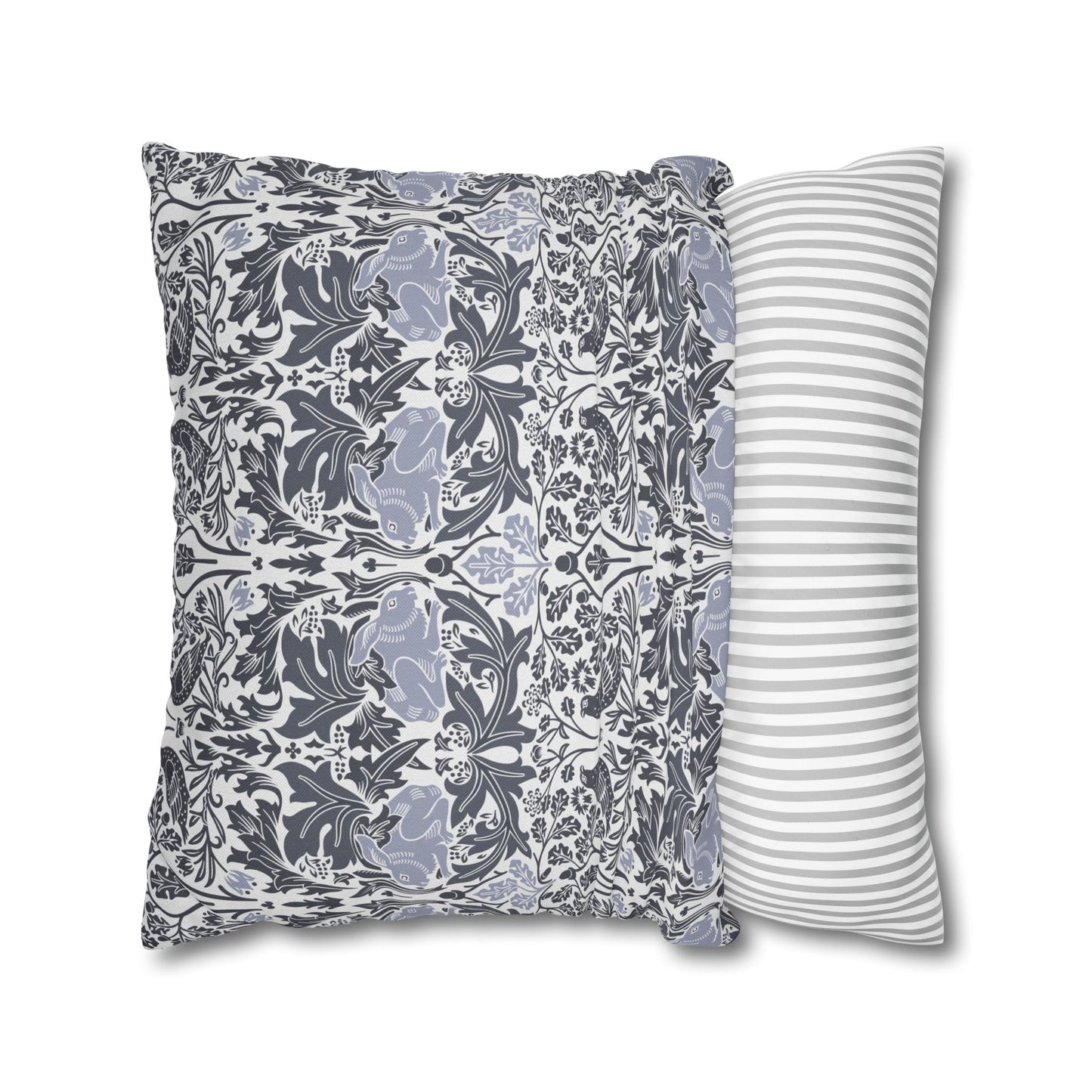 Two pillows, one with a floral pattern and the other with a striped pattern, on a white background.
