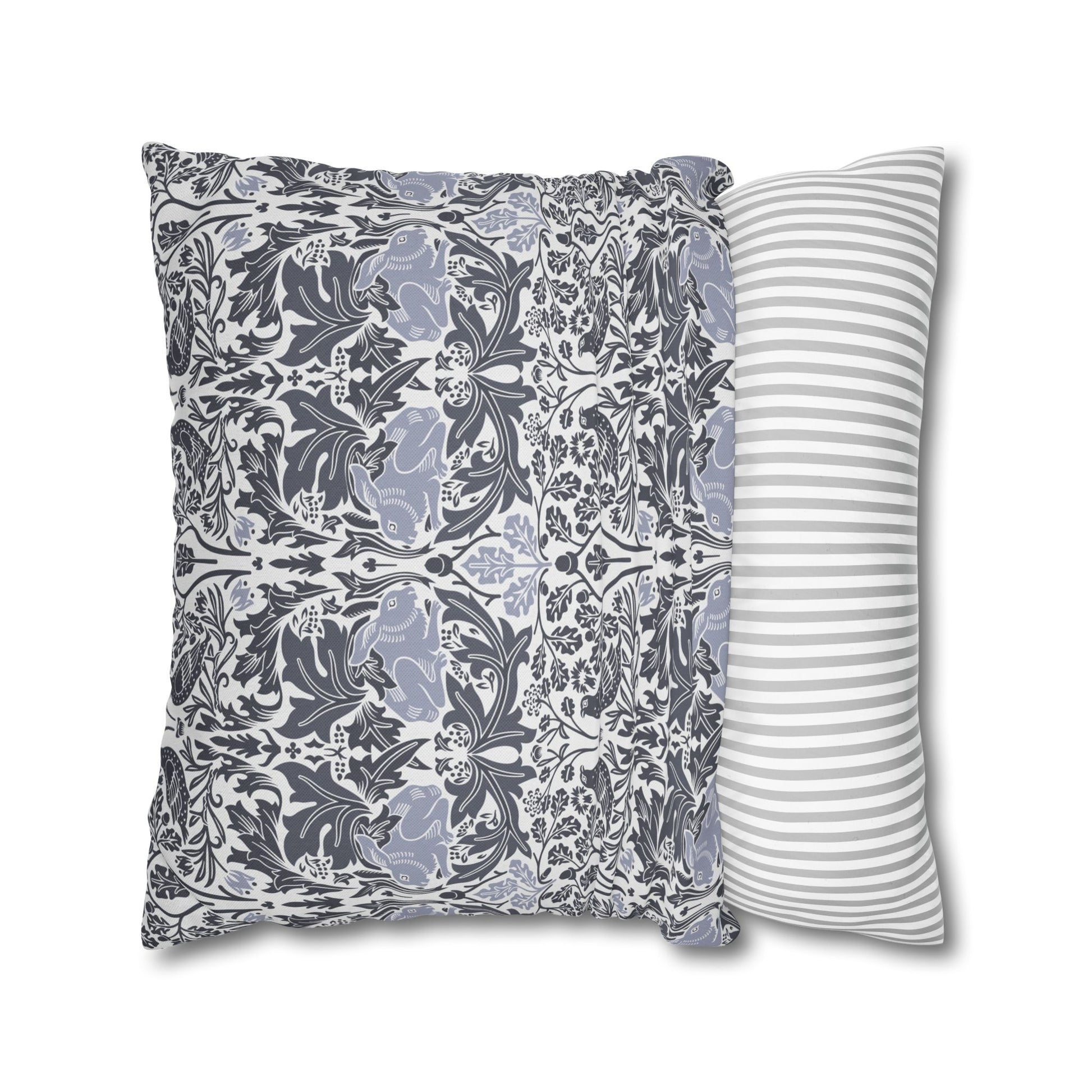 Two pillows, one with a floral pattern and the other with a striped pattern, on a white background.