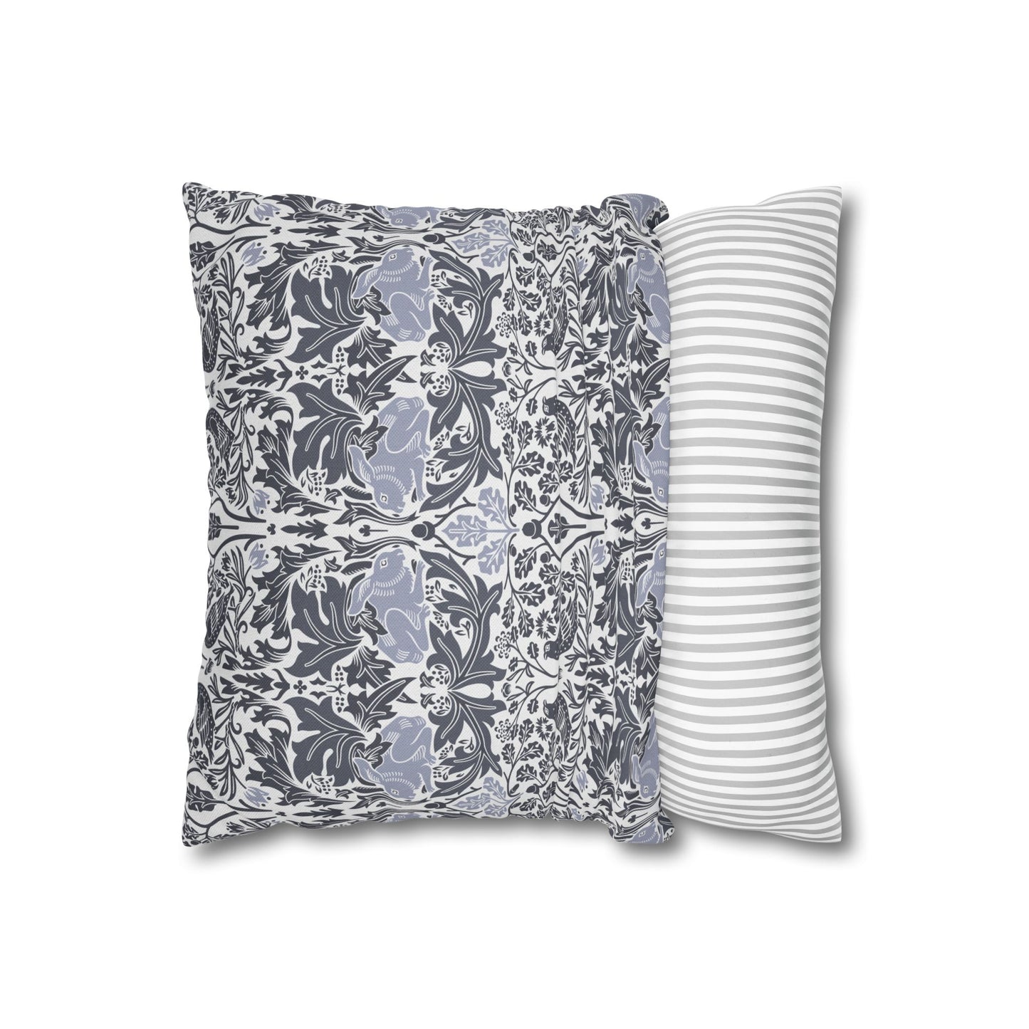 Two pillows, one with floral pattern and one with stripes, on a white background