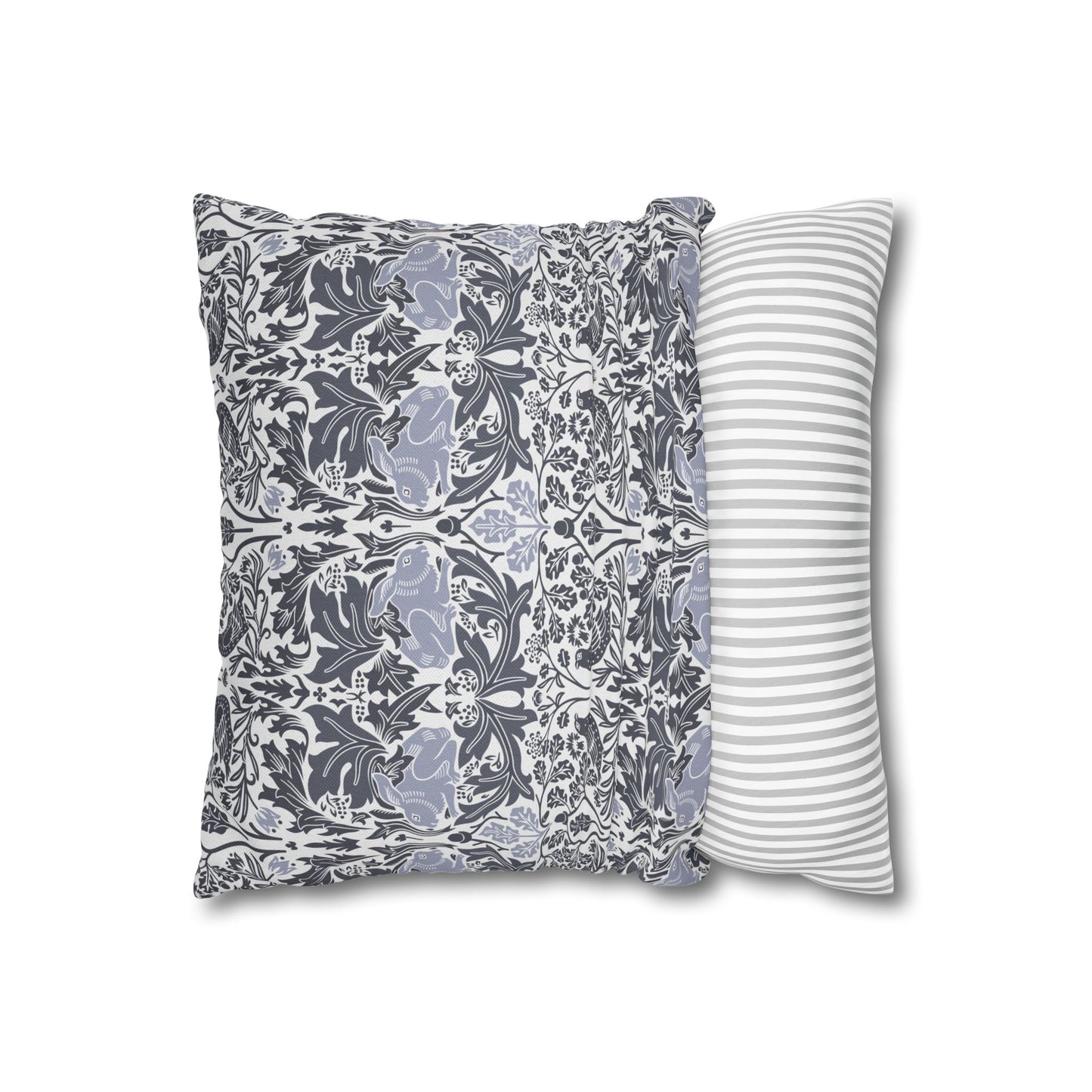 Two pillows, one with floral pattern and one with stripes, on a white background