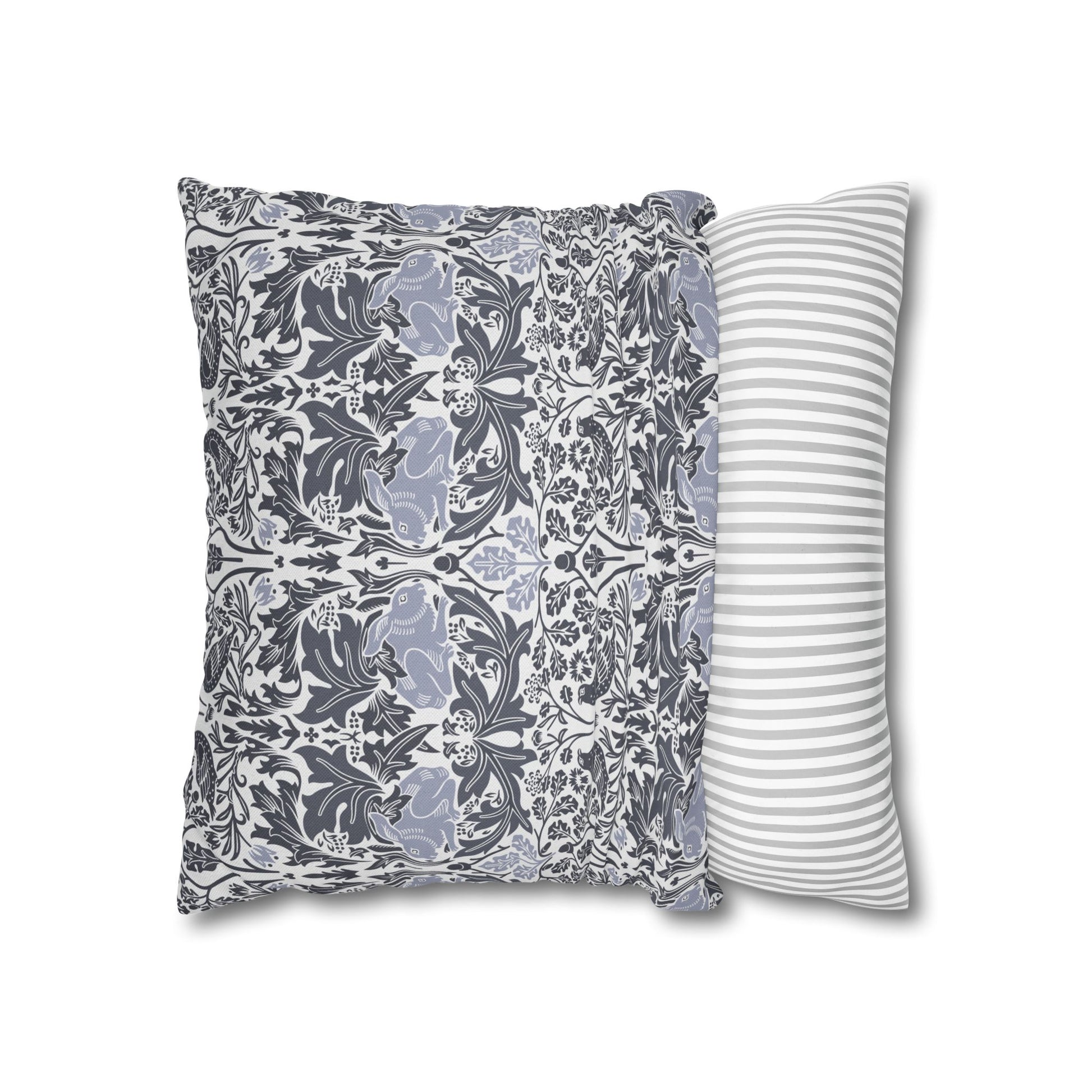 Two pillows, one with a floral pattern and the other with a striped pattern, on a white background.