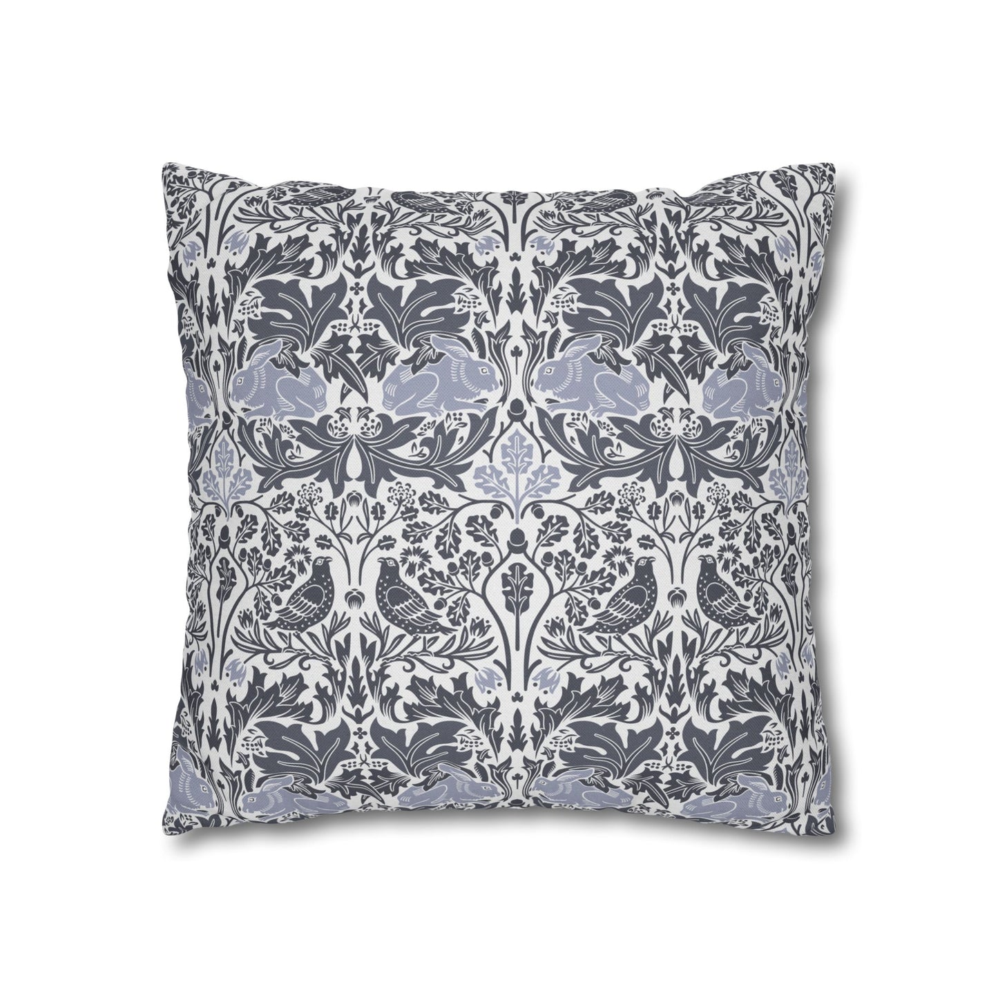 Decorative pillow with intricate floral and bird pattern on a white background