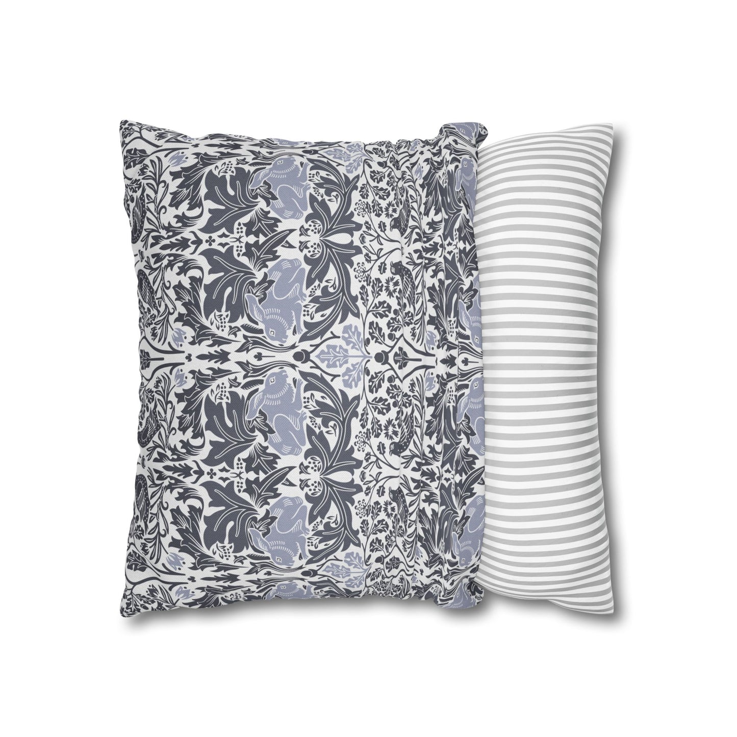 Two pillows, one with floral pattern and one with stripes, on a white background