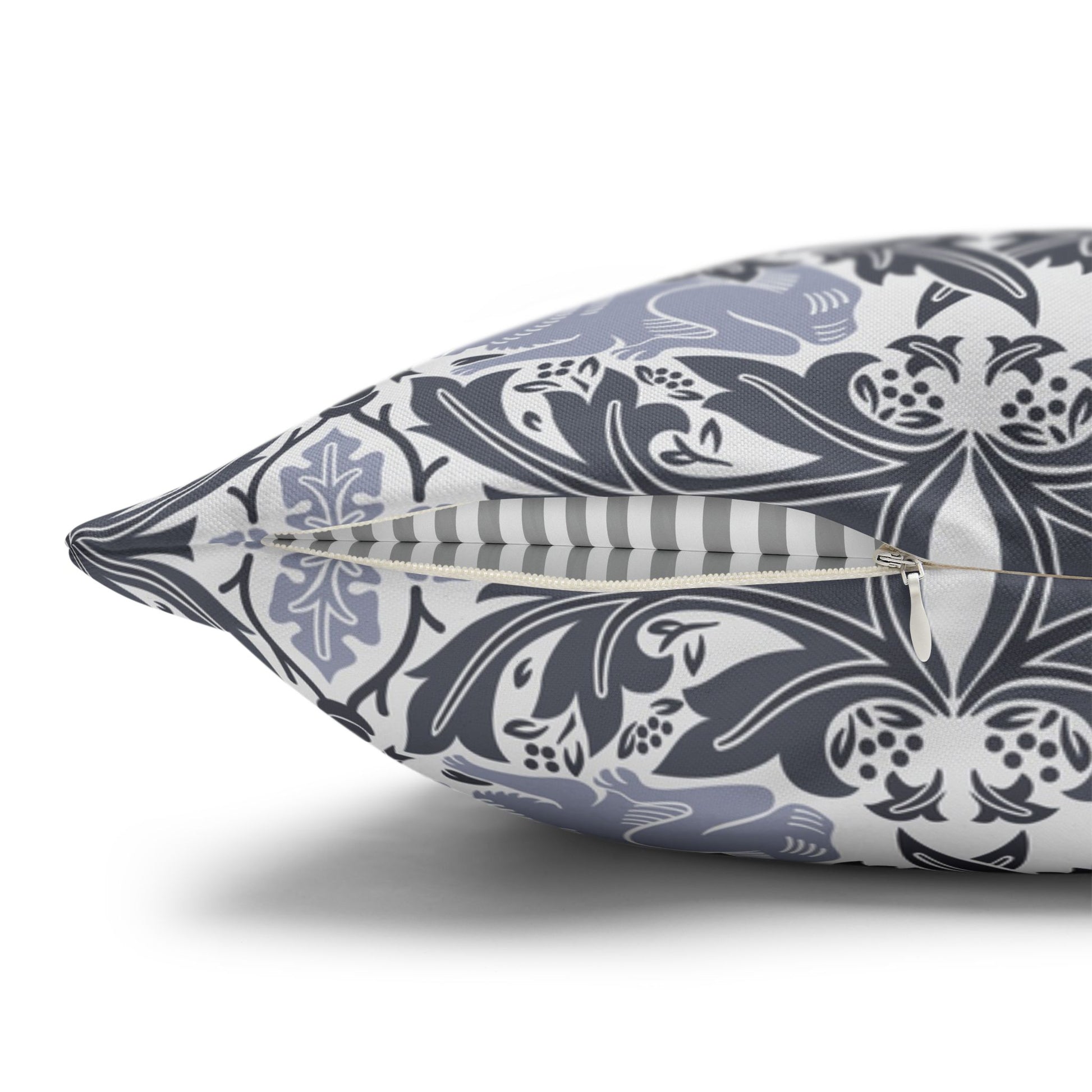 Decorative pillow with a blue and white pattern on a white background