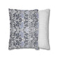 Two pillows, one with a floral pattern and the other with a striped pattern, on a white background.