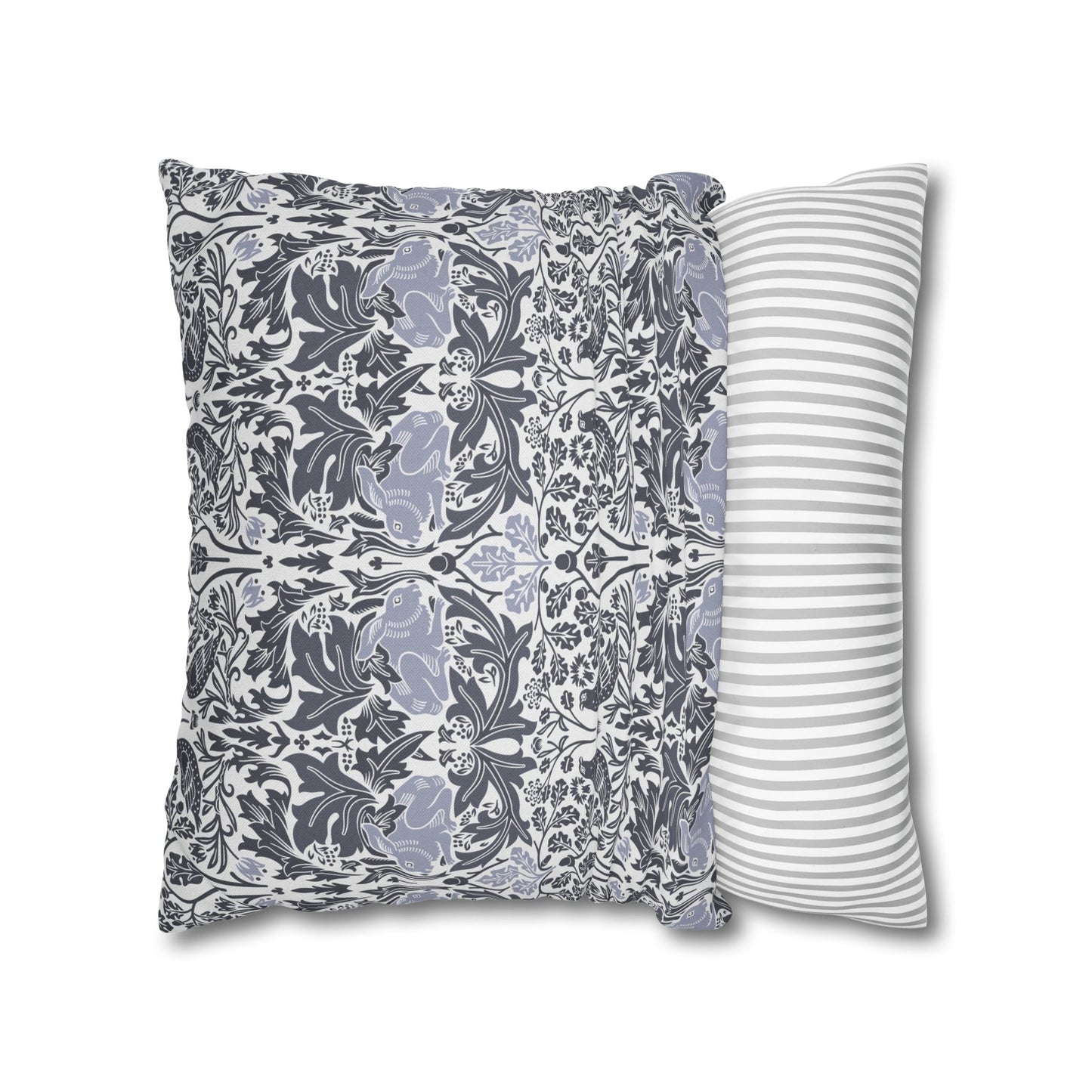 Two pillows, one with a floral pattern and the other with a striped pattern, on a white background.
