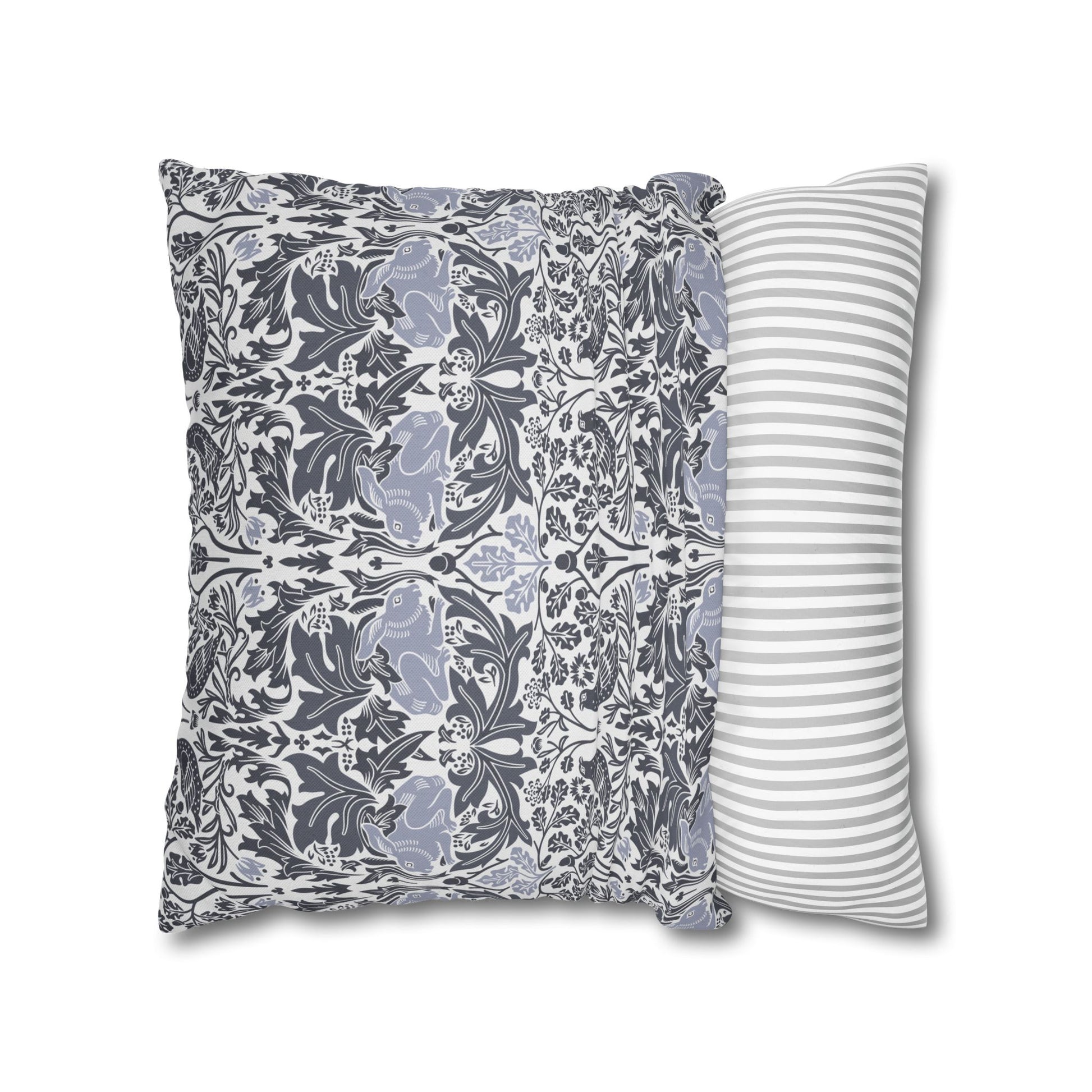 Two pillows, one with a floral pattern and the other with a striped pattern, on a white background.