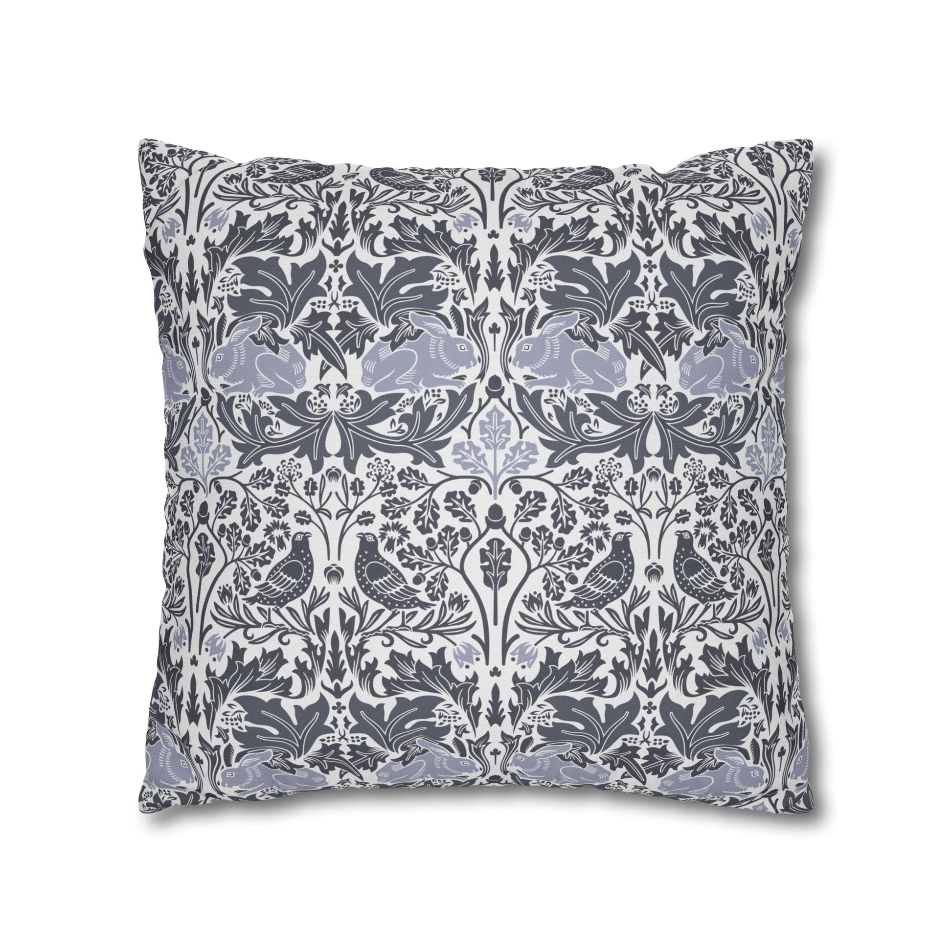 Decorative pillow with a floral and bird pattern on a white background