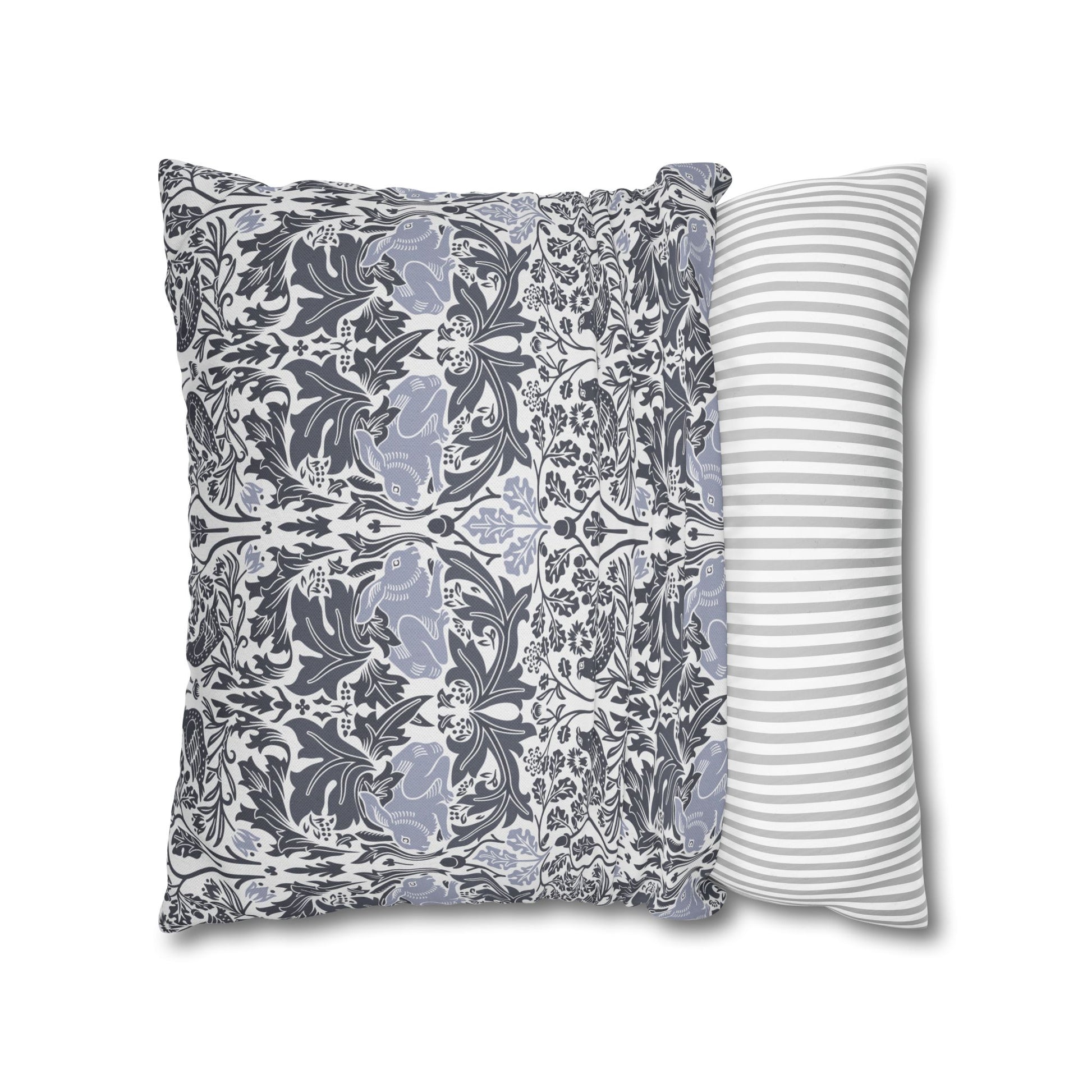 Two pillows, one with a floral pattern and the other with a striped pattern, on a white background.