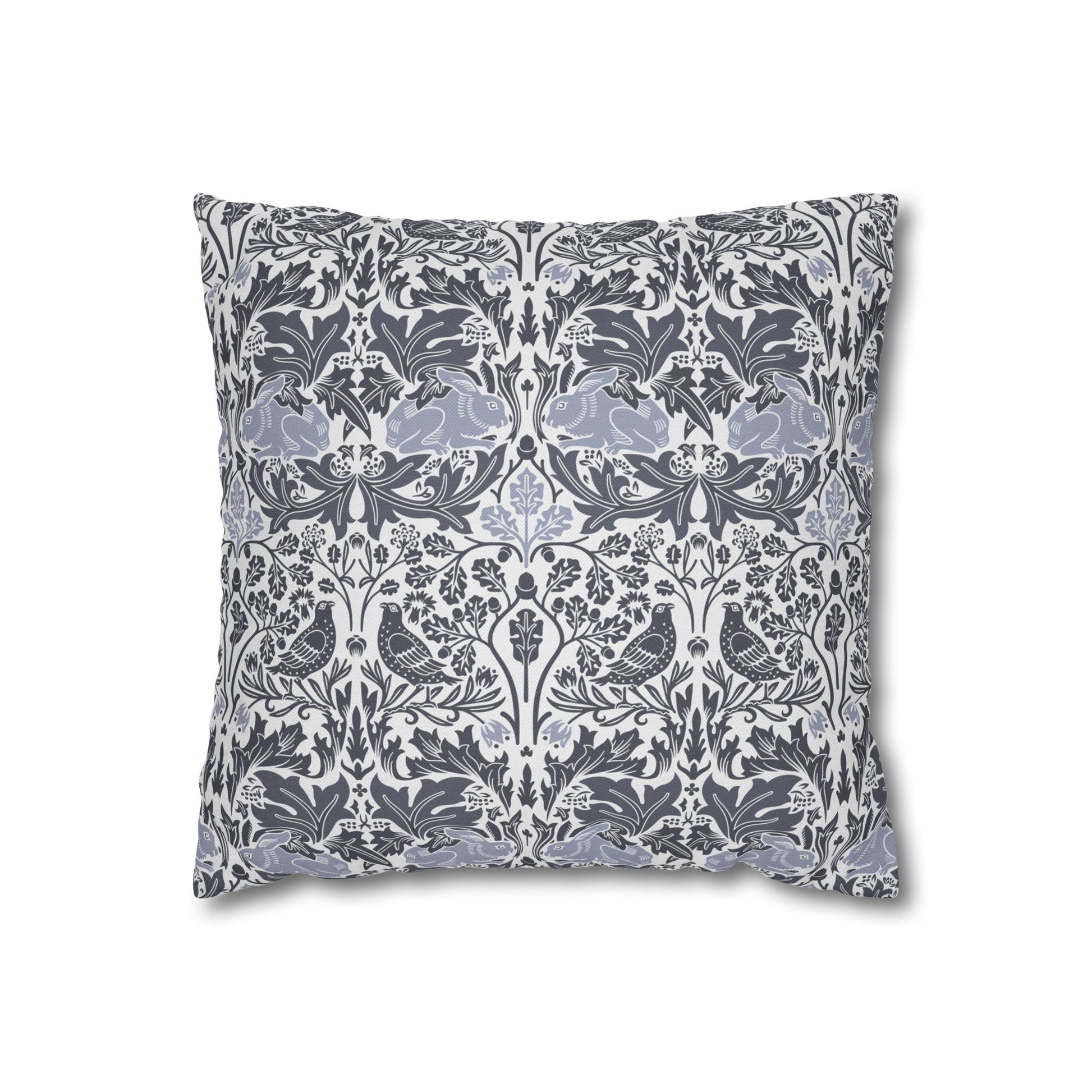 Decorative pillow with floral and bird pattern on a white background