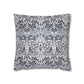 Decorative pillow with intricate floral and bird pattern on a white background