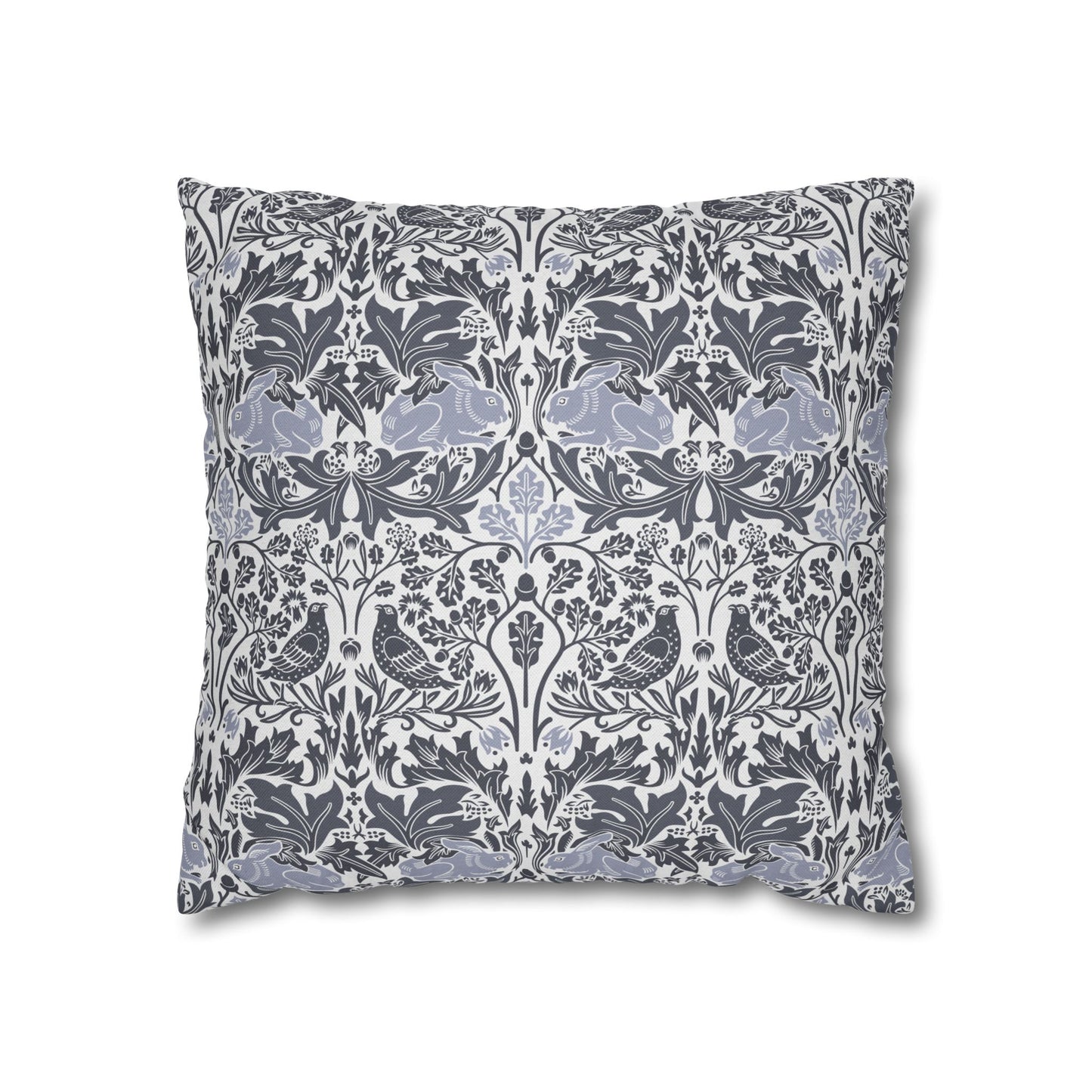 Decorative pillow with intricate floral and bird pattern on a white background