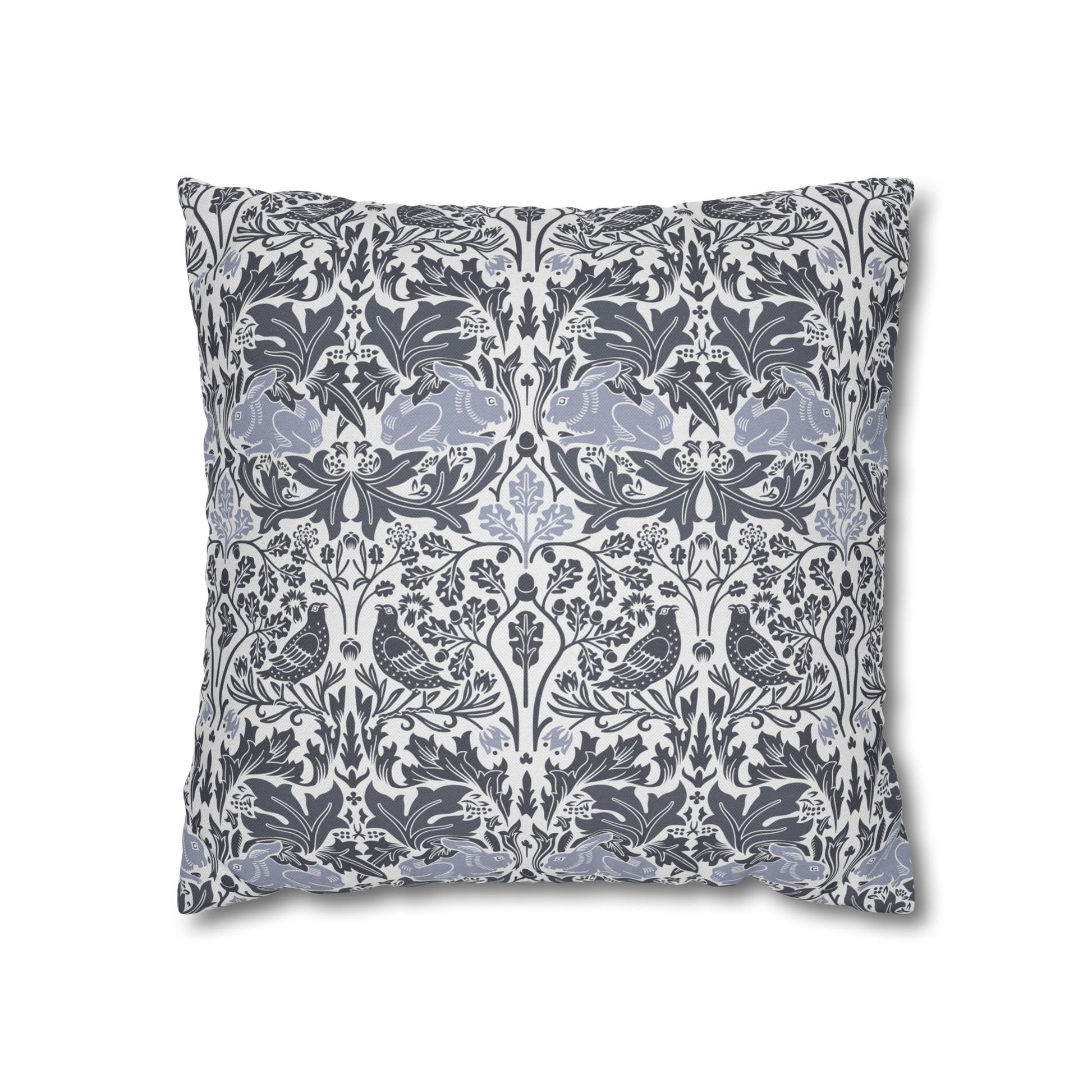 Decorative pillow with intricate floral and bird pattern on a white background