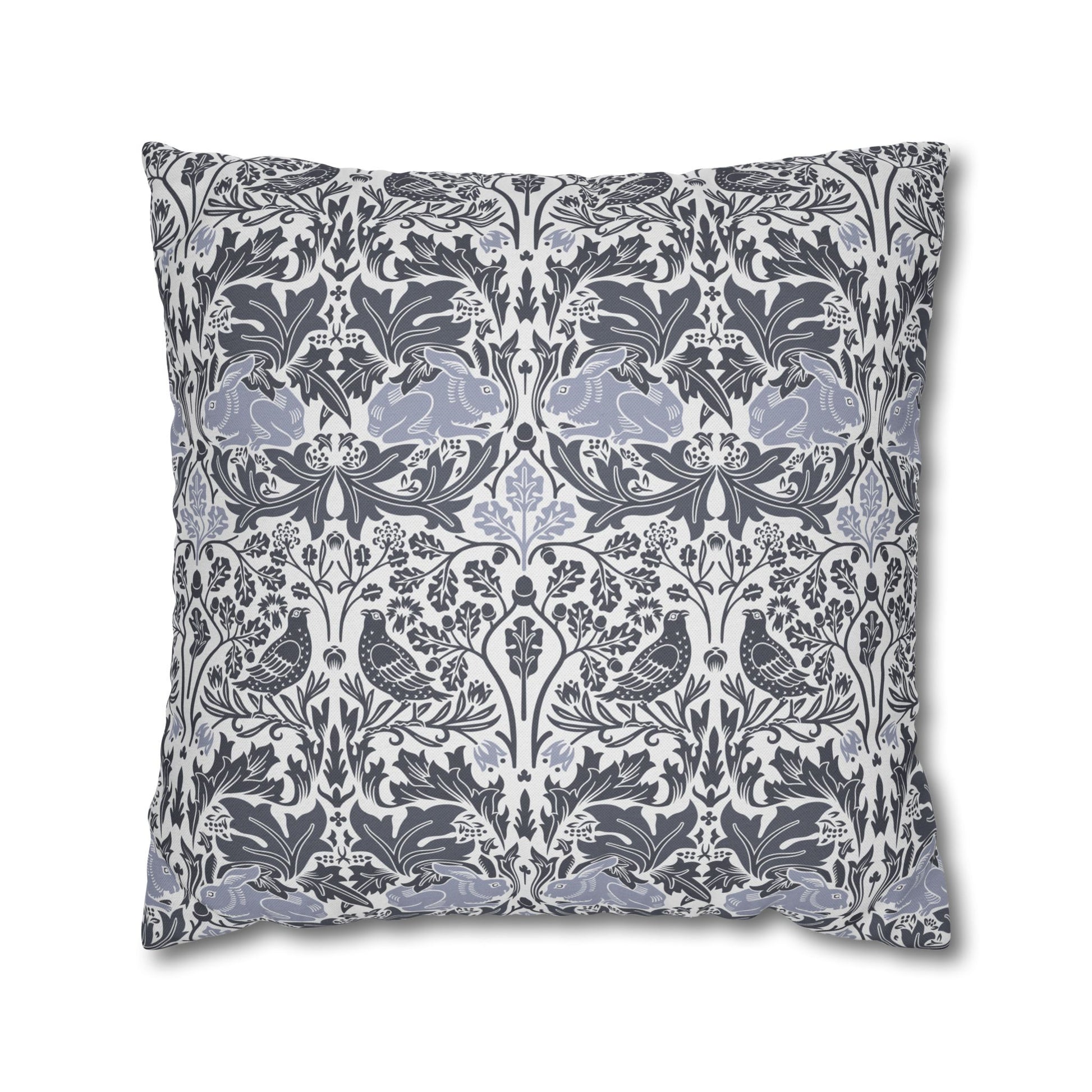 Decorative pillow with floral and bird pattern on a white background