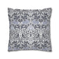 Decorative pillow with a floral and bird pattern on a white background