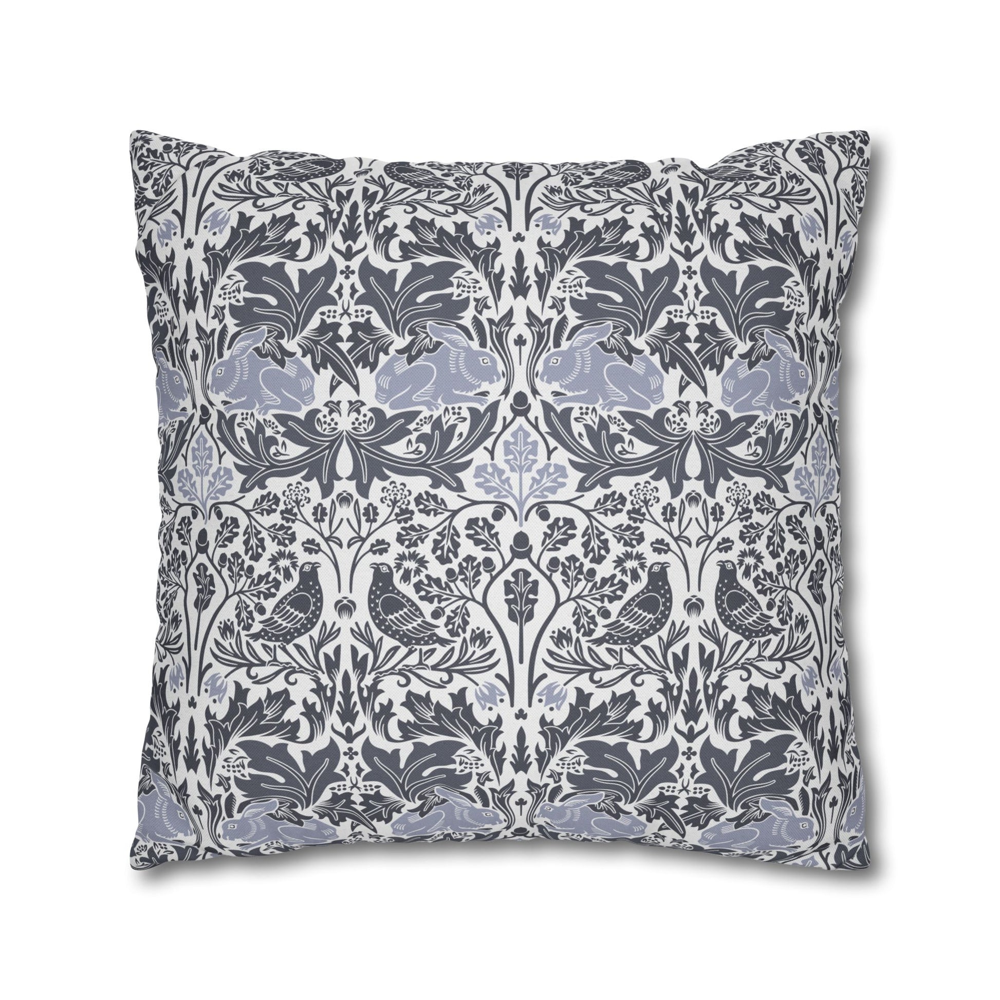 Decorative pillow with a floral and bird pattern on a white background