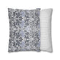 Two patterned pillows, one with a floral design and the other with stripes, on a white background.