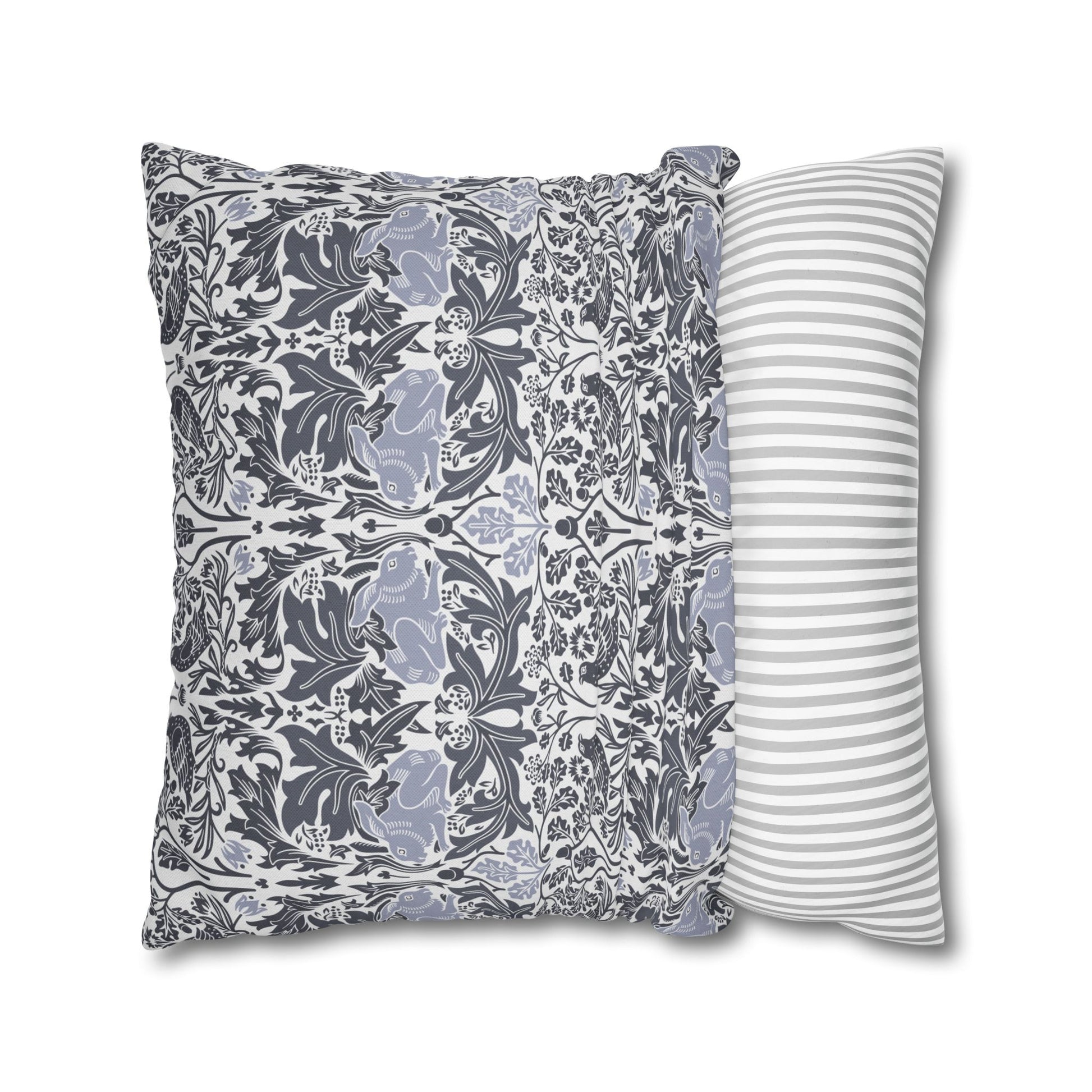 Two patterned pillows, one with a floral design and the other with stripes, on a white background.