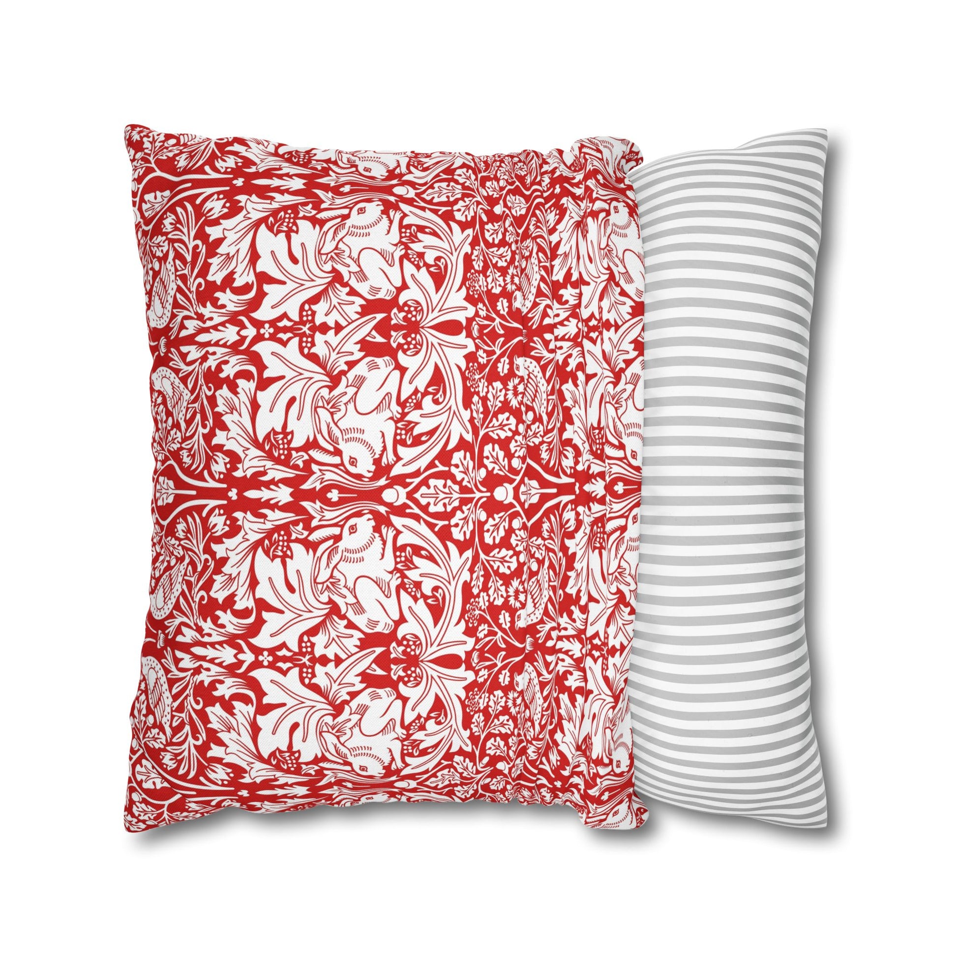 Two pillows, one with red and white pattern and the other with gray stripes, on a white background.