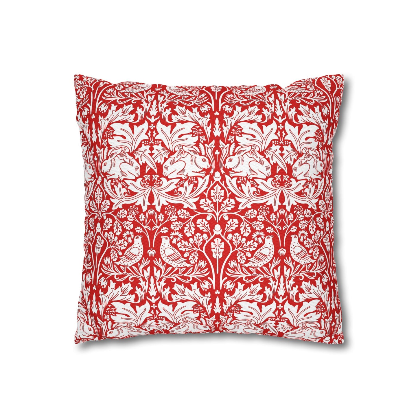 Decorative pillow with red and white floral and bird pattern on a white background