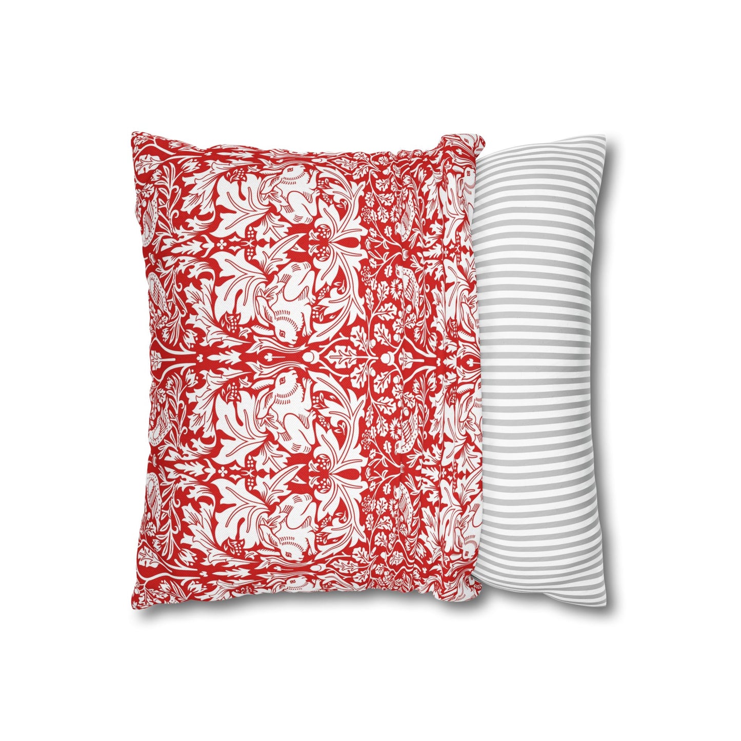 Two pillows, one with red floral pattern and one with white stripes, on a white background.