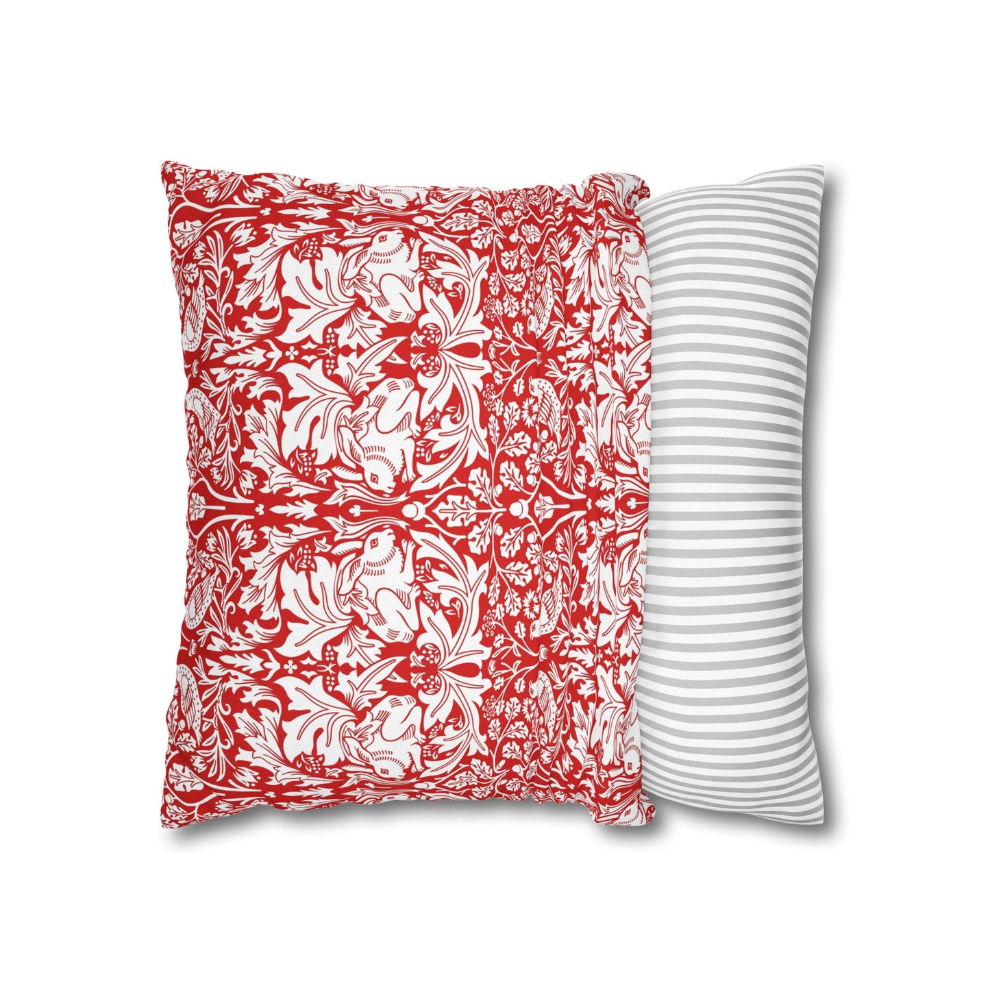Two pillows, one with a red and white floral pattern and the other with a gray and white striped pattern, on a white background.