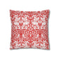 Decorative pillow with red and white floral and bird pattern on a white background