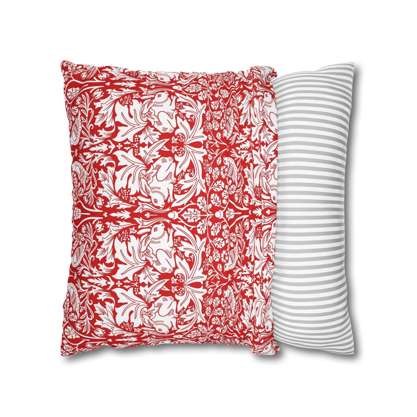 Two pillows, one with red and white floral pattern and the other with gray and white stripes, on a white background.