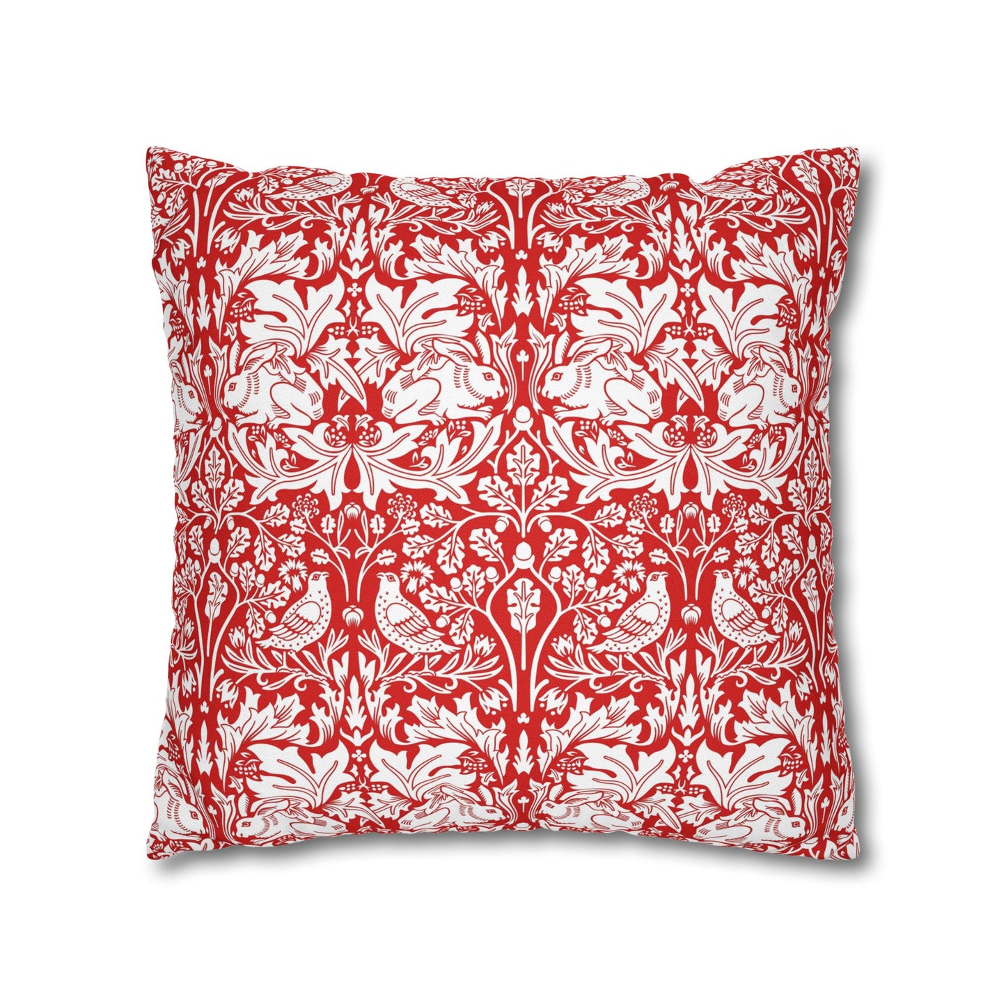 Decorative pillow with red and white floral and bird pattern on a white background
