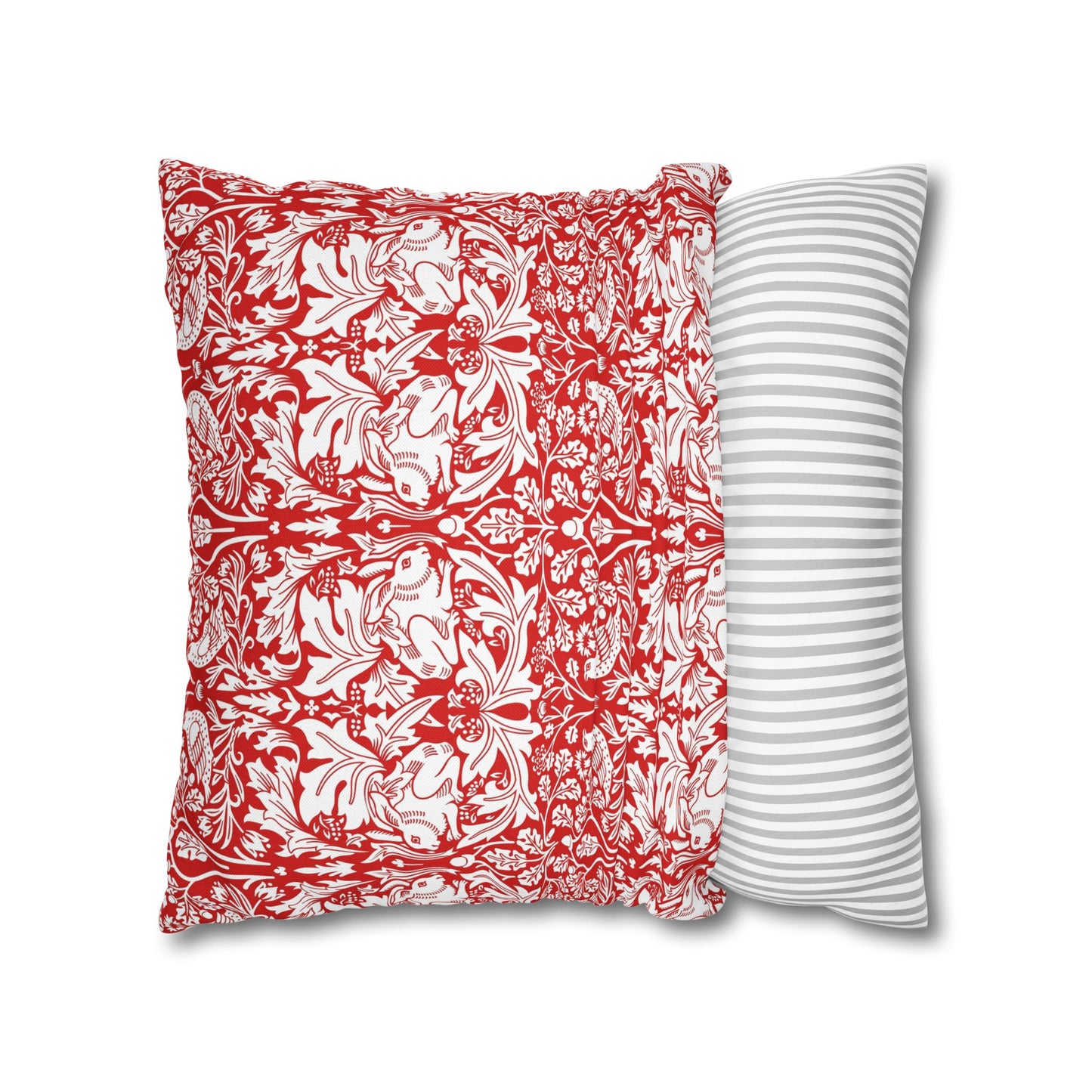 Two pillows, one with red and white floral pattern and the other with gray and white stripes, on a white background.