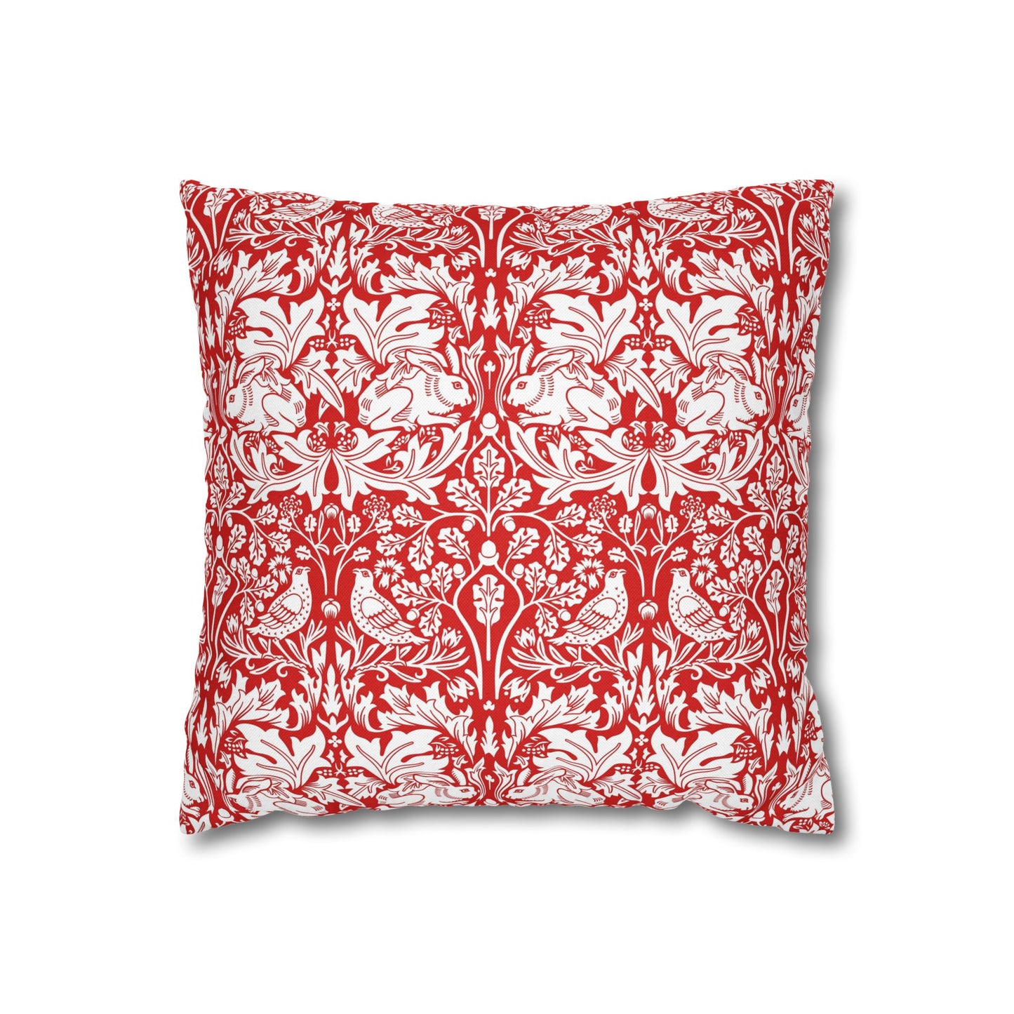 Decorative pillow with red and white floral and animal pattern on a white background