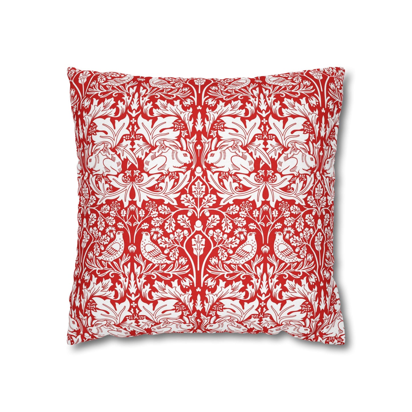 Decorative pillow with red and white floral and bird pattern on a white background