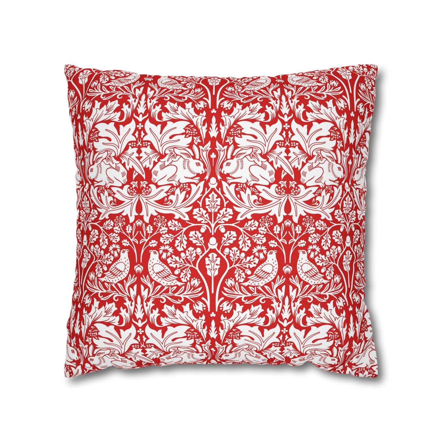 Decorative pillow with red and white floral and bird pattern on a white background