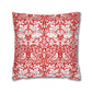 Decorative pillow with red and white floral and animal pattern on a white background