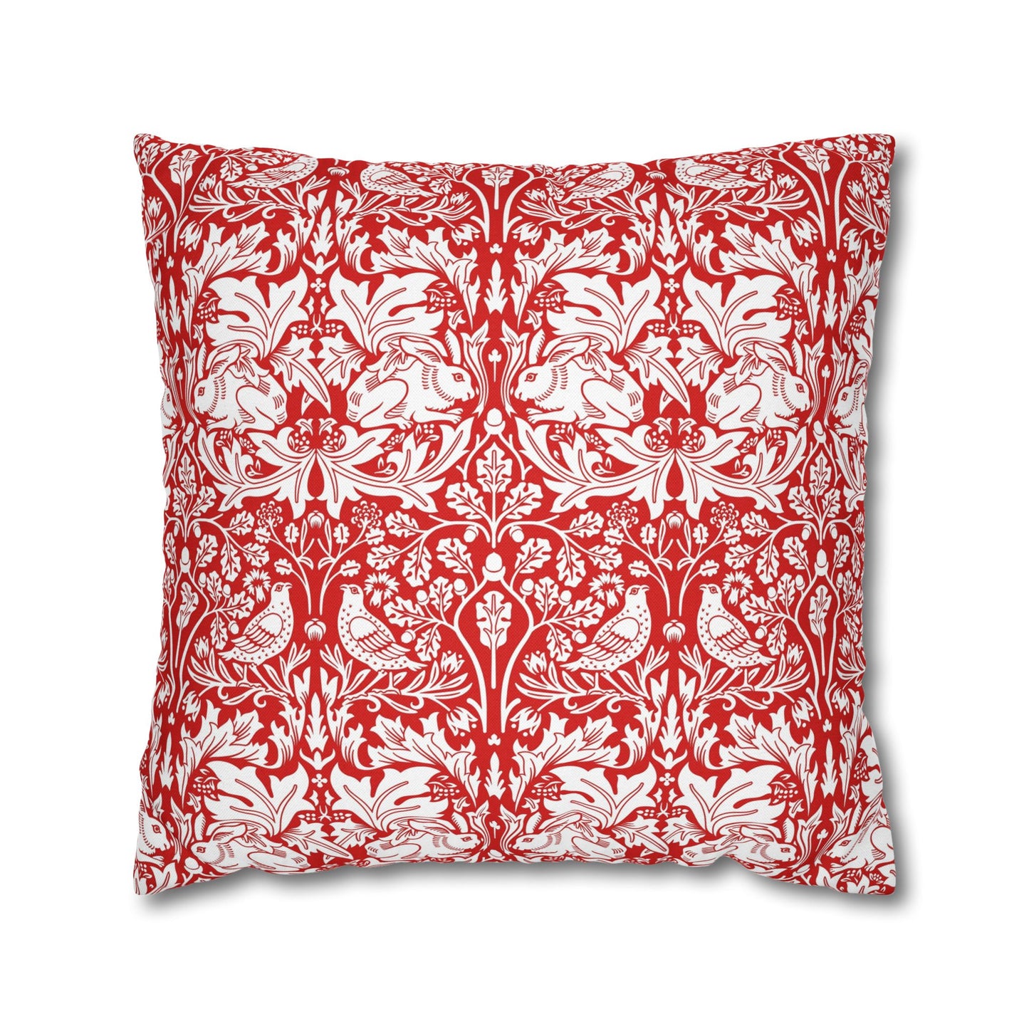 Decorative pillow with red and white floral and animal pattern on a white background