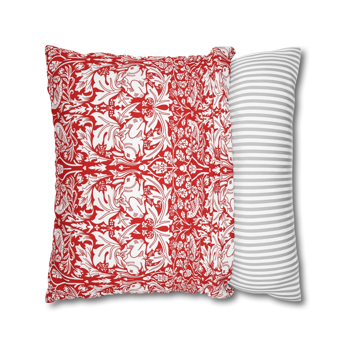 Two pillows, one with red floral pattern and one with white stripes, on a white background.