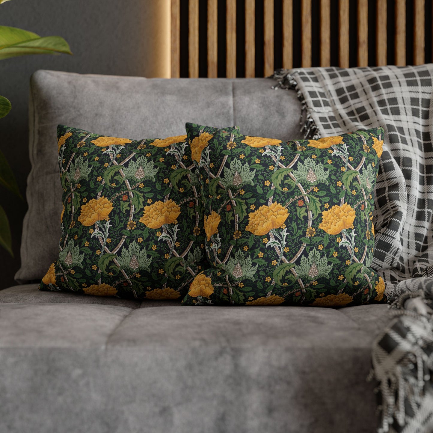 Decorative pillows with floral pattern on a gray sofa
